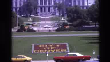 Denver Colorado USA (1974): Cars Driving By City Of Denver Sign