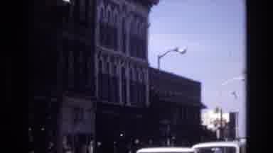 Denver Colorado USA (1974): Cars Passing In Front Of Building