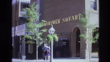 Denver Colorado USA (1974): Man And Woman Standing Outside Large Brown Building