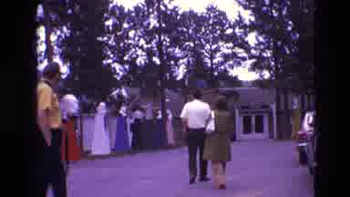 South Dakota USA (1974): People Walking And Man In Yellow Shirt With Camera