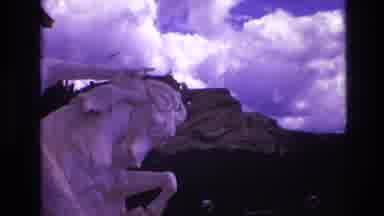 South Dakota USA (1974): Mountain Blue Sky Clouds Trees With White Statue Cave