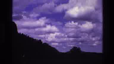 South Dakota USA (1974): Panning Sky With Clouds And Silhouette Of Landscape With