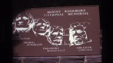 South Dakota USA (1974): Someone Videotaping Sign At Mount Rushmore With 4 Famous