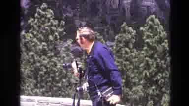 South Dakota USA (1974): Man With Cameras Mugs For The Camera
