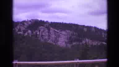 South Dakota USA (1974): Landscape Clip Of Forest And Mountain Range From Afar