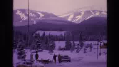 Vail Colorado USA (1974): Car Driving By People And Dogs Walking In Front Of