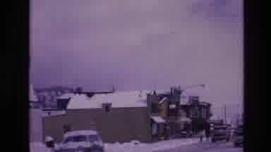Vail Colorado USA (1974): Cars And Pedestrians In Snowy Business District