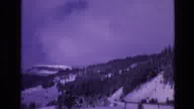 Vail Colorado USA (1974): Roadway Cut Into The Side Of A Mountain With Cars