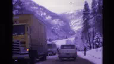 Vail Colorado USA (1974): Vehicles And People On An Icy Road