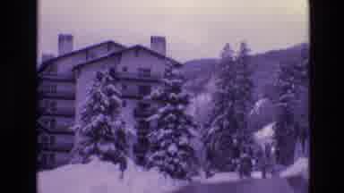 Vail Colorado USA (1974): A Car Driving Towards A Snow-Covered Hotel Resort