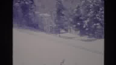 Vail Colorado USA (1974): Skiers Gather To Take A Ski Lift That Runs Over A