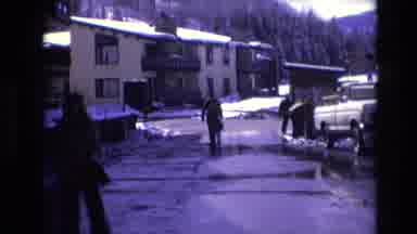Vail Colorado USA (1974): Two People Walking Through Snowy Area Away From