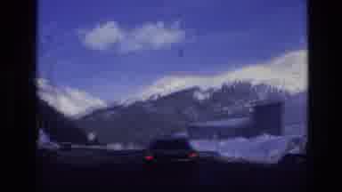 Vail Colorado USA (1974): Driving Down A Road In A Surrounded By Large Mountains