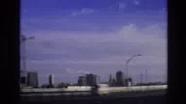 Vail Colorado USA (1974): Driving On A Highway With A Skyline View Of A City