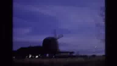 Vail Colorado USA (1974): Driving Past A Field Towards A Giant Windmill