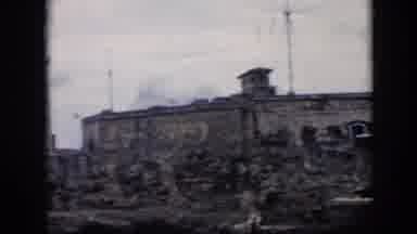 Cuba (1956): Clouds Stone Wall Three People Tourists Rocks Building Attraction