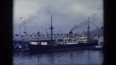 Cuba (1956): Moored Transport Ships And Billowing Smoke Stacks Fill A Harbor