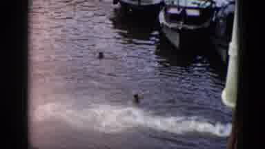Cuba (1956): Vintage Footage Of People Swimming Around Boats Near A Water Let Out