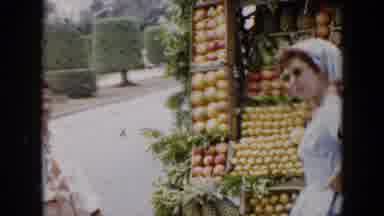 Cuba (1956): People Pose In Front Of A Roadside Fruit Stand On A Windy Day