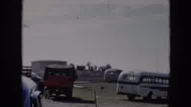 Cuba (1956): Antique Buses Near Ocean Cliff-Side With Man Running