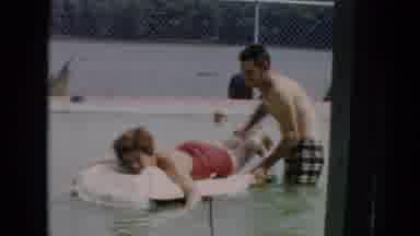Cuba (1956): Man Pushing Woman On Floating Device In Pool
