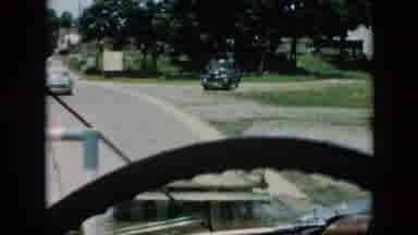 Cuba (1956): A Car Slowly Ambling Down A Street