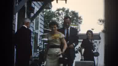 Dayton Ohio USA (1958): A Smartly Dressed Man And Woman Leaving A Building