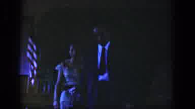 Dayton Ohio USA (1958): Man And Woman Walking Past American Flag