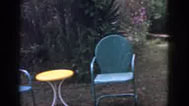 Dayton Ohio USA (1958): A Home Garden With Flowers Two Plastic Chairs And A Yellow