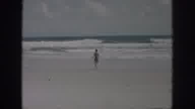 New Orleans Louisiana USA (1958): Lady Running Towards The Sea On A Beach