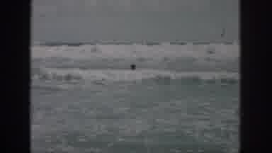 New Orleans Louisiana USA (1958): Person Swimming In The Ocean Waves And View Of
