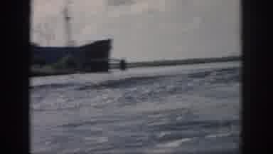 New Orleans Louisiana USA (1958): A Ship Moving Along A Waterway On A Partly