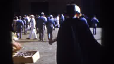 Virginia USA (1958): People Walking Around Man In Black Top Hat And Cape