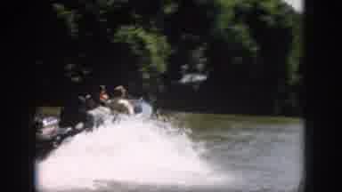 Virginia USA (1958): Powerboat Speeding Down The River Past The Heavily Treed