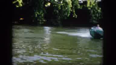 Virginia USA (1958): Man Driving A Speedboat Down The River