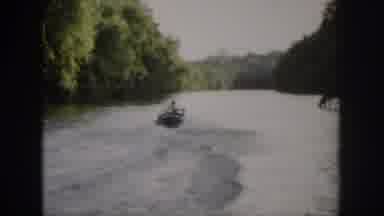Virginia USA (1958): Man In Speedboat Racing Down A Scenic Body Of Water