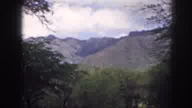 Hawaii USA (1959): View Of Several Mountains With Trees Nearby Then In A Car