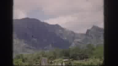 Hawaii USA (1959): Grey Mountains Stretch Above A Valley Floor Filled With Brush