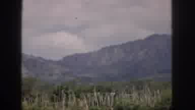 Hawaii USA (1959): Cloud Covered Skies Linger Above Tall Beautiful Mountains That