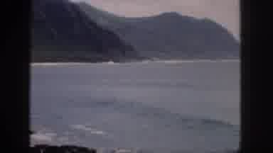 Hawaii USA (1959): Small Ocean Waves Lapping Up Onto Shore Within A Small Cove