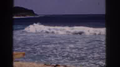 Hawaii USA (1959): Man On Beach Walking With Surfboard Showing Waves And Hills And