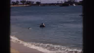 Hawaii USA (1959): Children Walking By Sandy Ocean Watching Inner Tube Swimmers