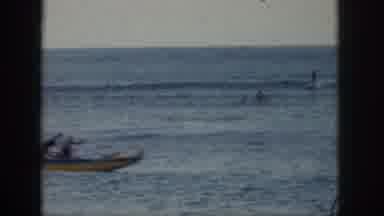 Hawaii USA (1959): People In The Water Having A Good Time Skiing And Rowing Their