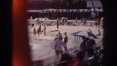 Hawaii USA (1959): Man And Woman Getting Up From Their Chairs At The Beach As A
