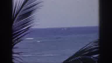 Hawaii USA (1959): A Ship Plows Through Rough Seas Parallel To Shore On A Windy