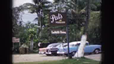 Hawaii USA (1959): Cars Parked Outside A Mountain