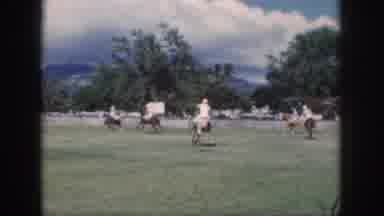 Oahu Hawaii USA (1959): A Group Of People Watching A Polo Match On A Large Field