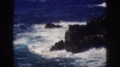 Oahu Hawaii USA (1959): Ocean Waves Crashing On A Rocky Cliff Shoreside With White