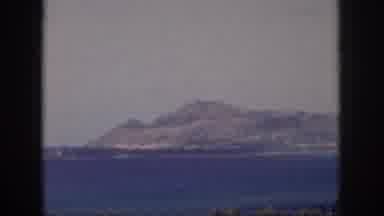 Oahu Hawaii USA (1959): Small Red And White Boat Approaches The Coast On A Sunny