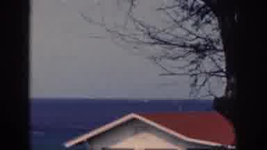 Oahu Hawaii USA (1959): Aircraft Carrier Sailing In Toward Shore With House